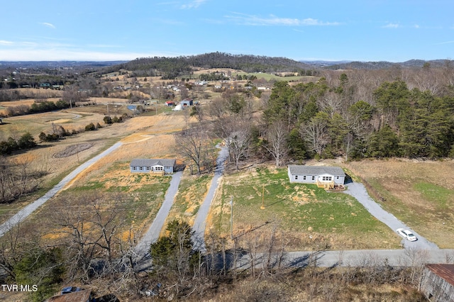 bird's eye view featuring a rural view and a wooded view