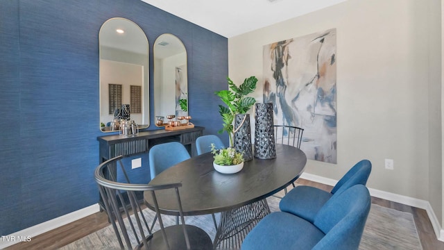 1807 Fox Meadows Cir, Bluff City, TN 37618 - dining area with baseboards, wood finished floors, and arched walkways