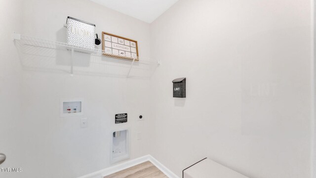 1807 Fox Meadows Cir, Bluff City, TN 37618 - laundry area with washer hookup, hookup for an electric dryer, baseboards, and light wood finished floors