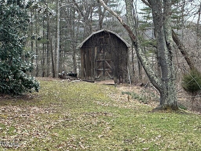 view of shed featuring a forest view