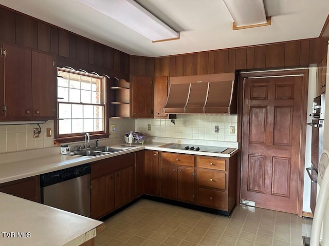 kitchen with a sink, light countertops, stainless steel dishwasher, black electric stovetop, and wall chimney exhaust hood
