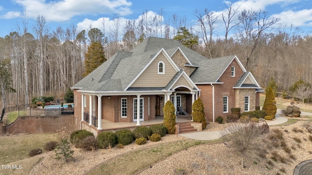 view of front of house with french doors and brick siding