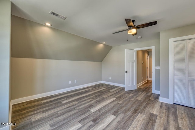 additional living space featuring visible vents, baseboards, and wood finished floors