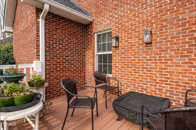 wooden terrace with area for grilling