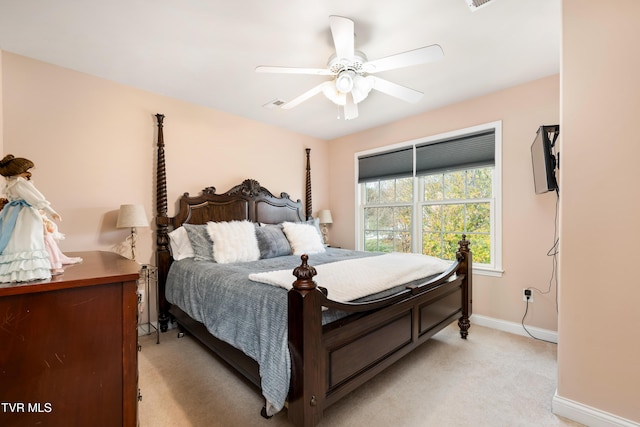 bedroom with baseboards, light carpet, and ceiling fan