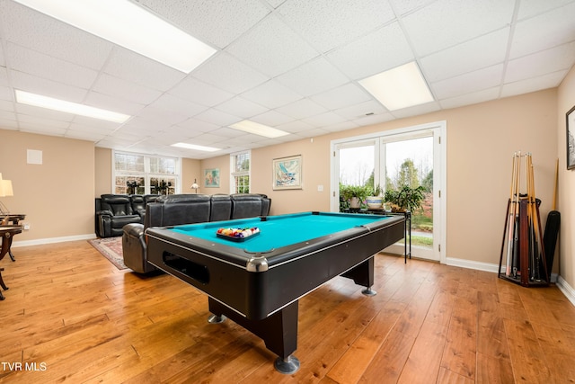 recreation room featuring pool table, light wood-style floors, baseboards, and a drop ceiling