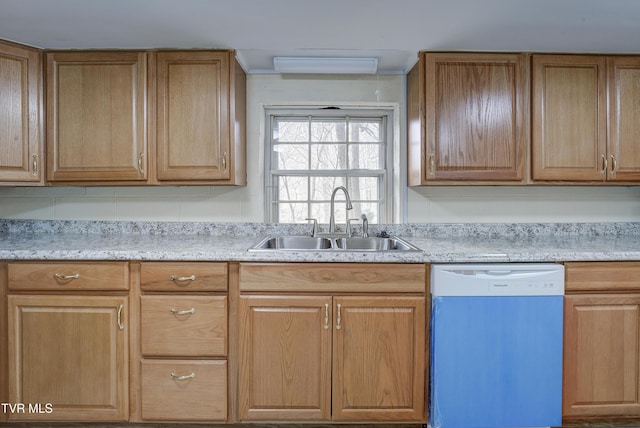 kitchen featuring a sink, dishwasher, and light countertops