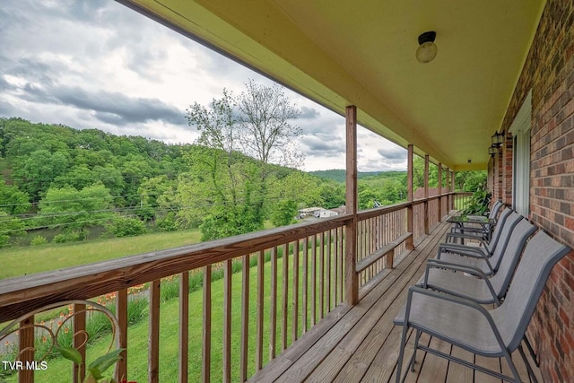 deck featuring a view of trees