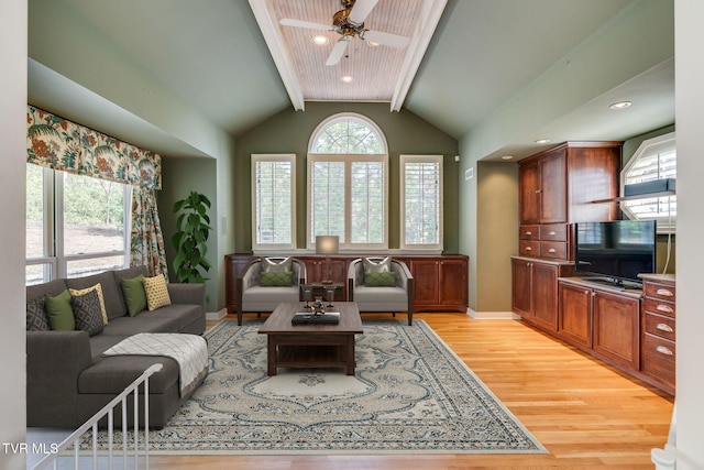 living room with ceiling fan, lofted ceiling with beams, light wood-style flooring, recessed lighting, and baseboards