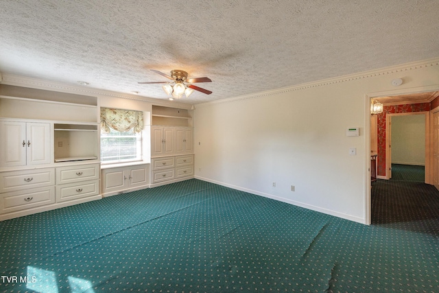 unfurnished bedroom featuring crown molding, a textured ceiling, dark colored carpet, a ceiling fan, and baseboards