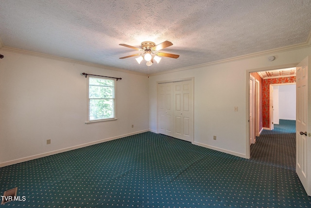 unfurnished bedroom with carpet floors, baseboards, and ornamental molding