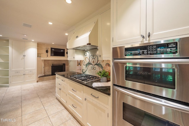 kitchen with decorative backsplash, light tile patterned flooring, recessed lighting, ventilation hood, and appliances with stainless steel finishes