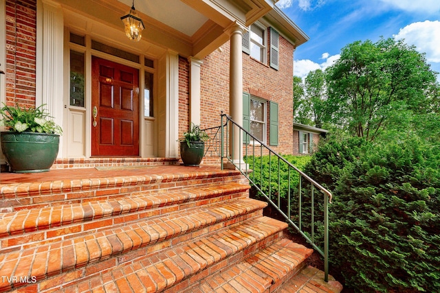 entrance to property with brick siding