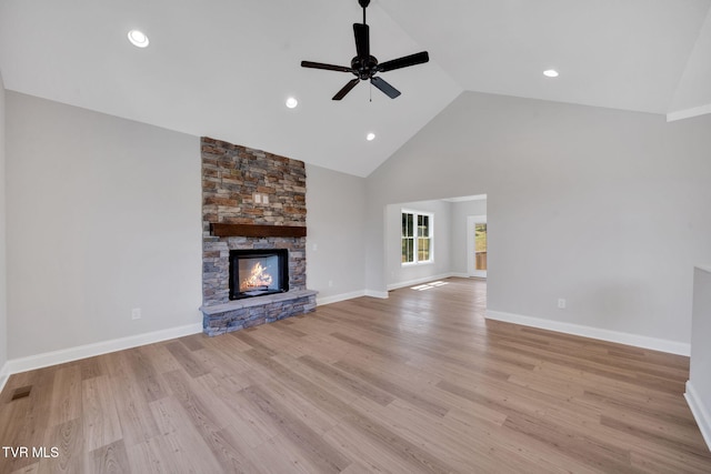 1110 Miller Dr, Jonesborough, TN 37659 - unfurnished living room featuring a ceiling fan, high vaulted ceiling, light wood finished floors, a stone fireplace, and recessed lighting