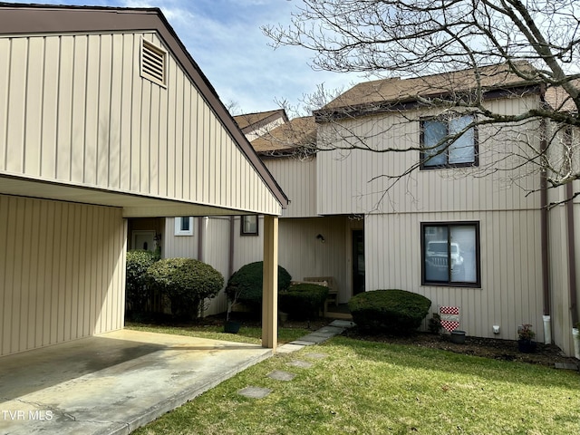 rear view of property with a lawn