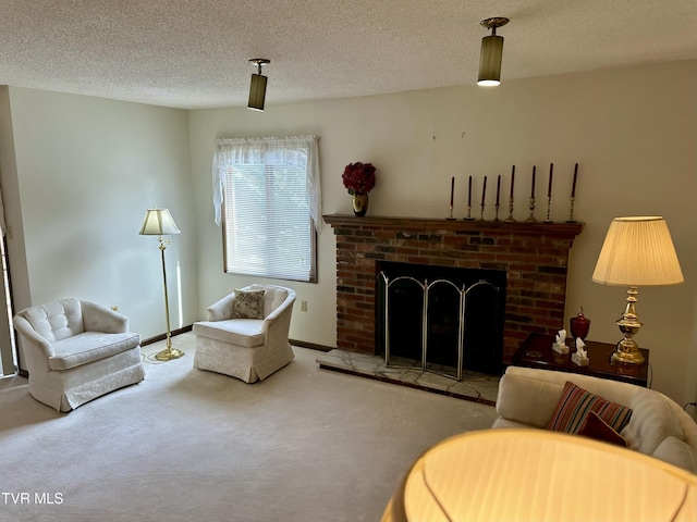 living room featuring a brick fireplace, carpet flooring, and a textured ceiling