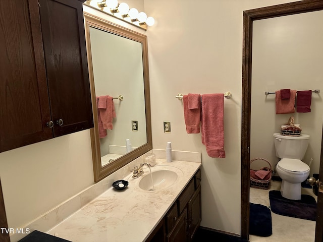 bathroom with toilet and vanity