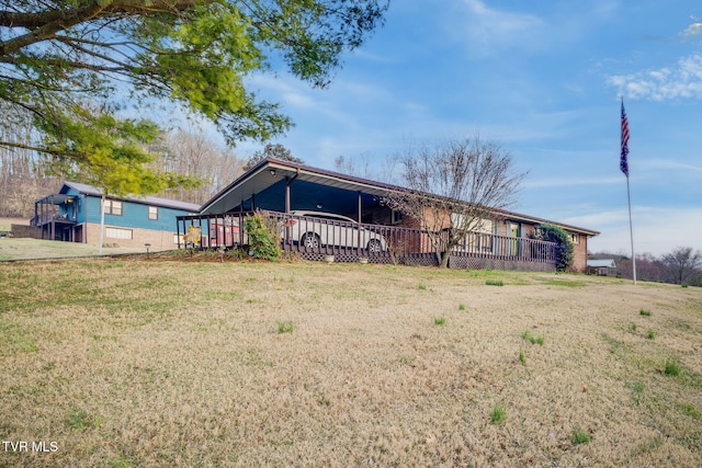 view of front of property featuring a front lawn and a wooden deck