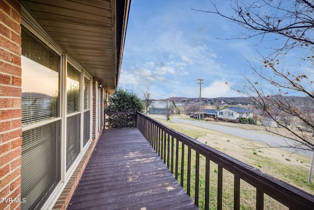 wooden terrace featuring a residential view