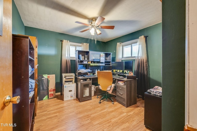 home office with ceiling fan and wood finished floors