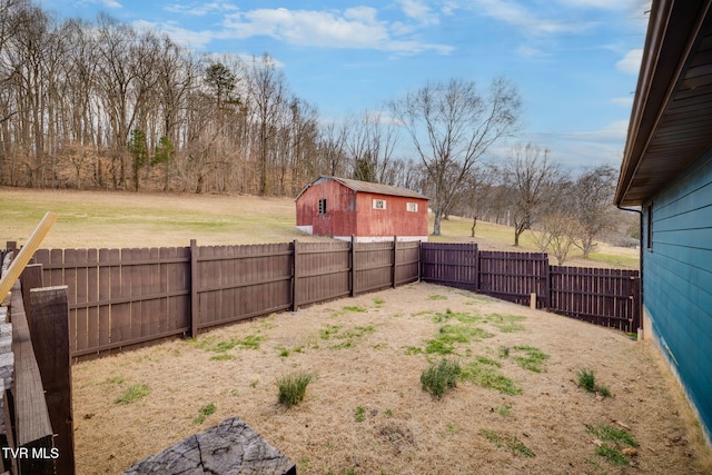 view of yard featuring an outbuilding and a fenced backyard