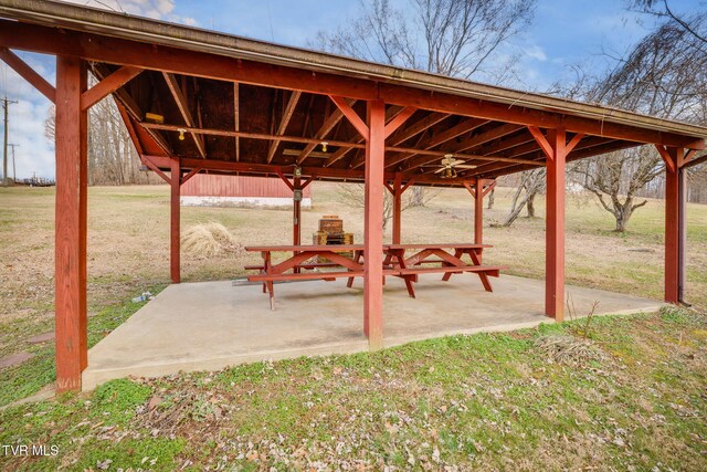 surrounding community featuring a gazebo, a patio area, and a lawn