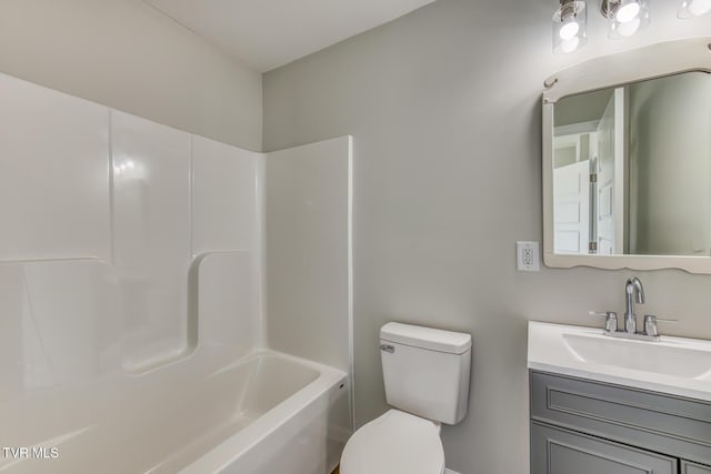 full bath featuring vanity, toilet, and shower / bathtub combination