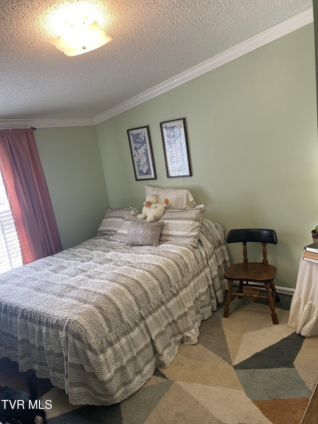 carpeted bedroom with a textured ceiling and ornamental molding