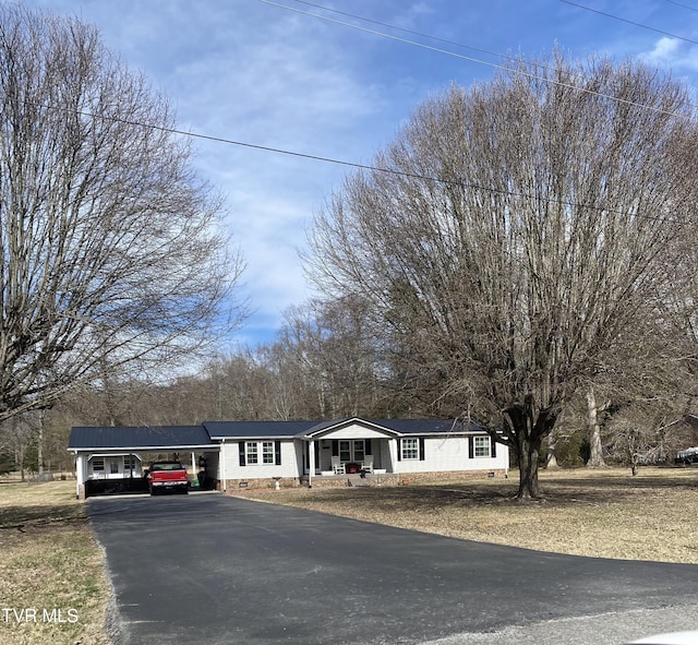 view of front of house featuring crawl space, aphalt driveway, and covered porch