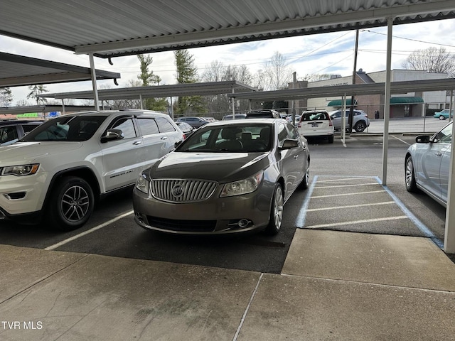 view of partially covered parking lot