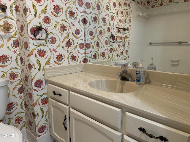 bathroom with vanity and toilet