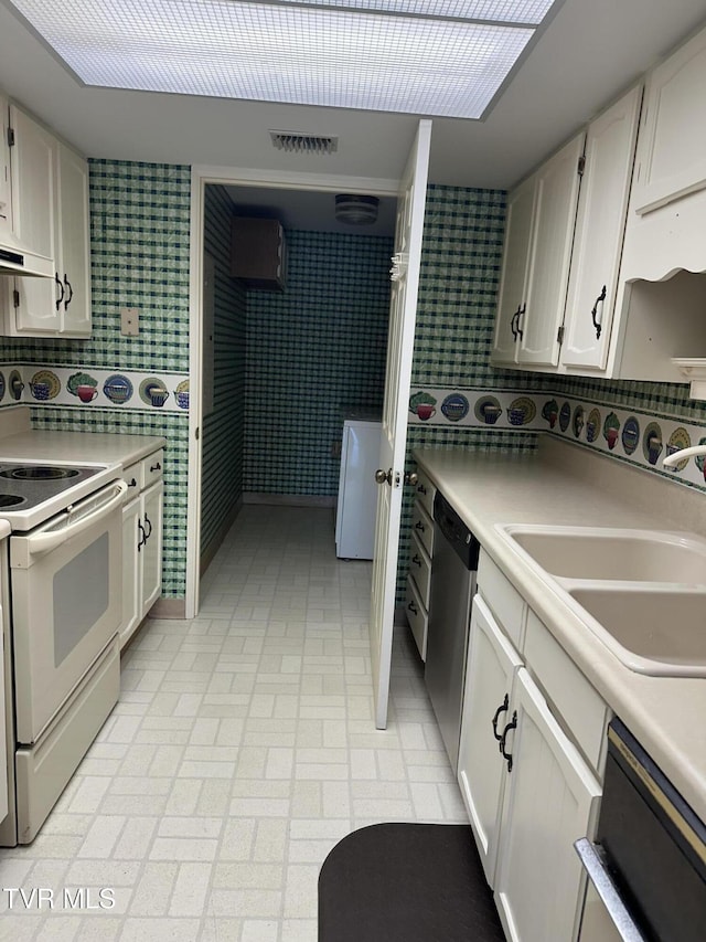 kitchen with visible vents, a sink, stainless steel dishwasher, white electric stove, and dishwasher