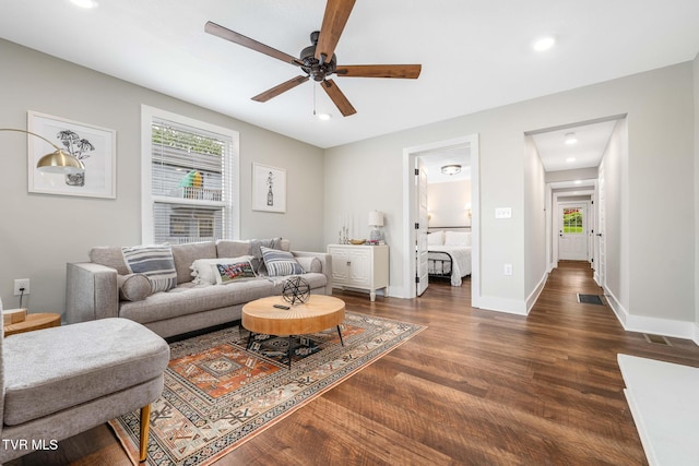 living room with visible vents, dark wood-type flooring, baseboards, recessed lighting, and a ceiling fan