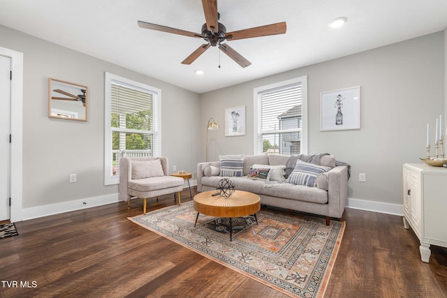 living area with dark wood-style floors, recessed lighting, ceiling fan, and baseboards