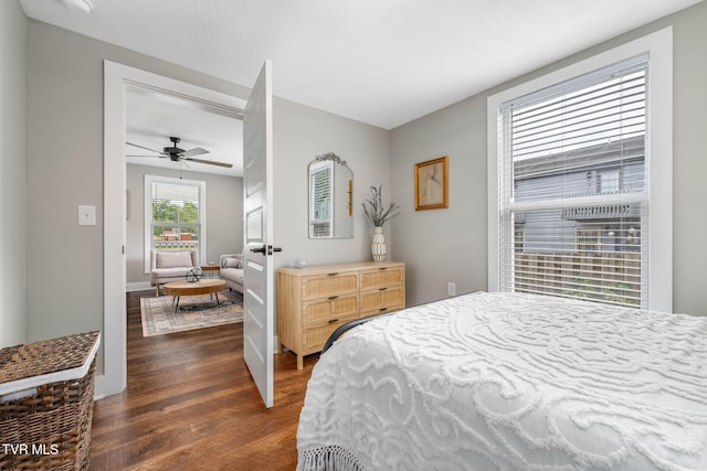 bedroom featuring dark wood-style floors and ceiling fan