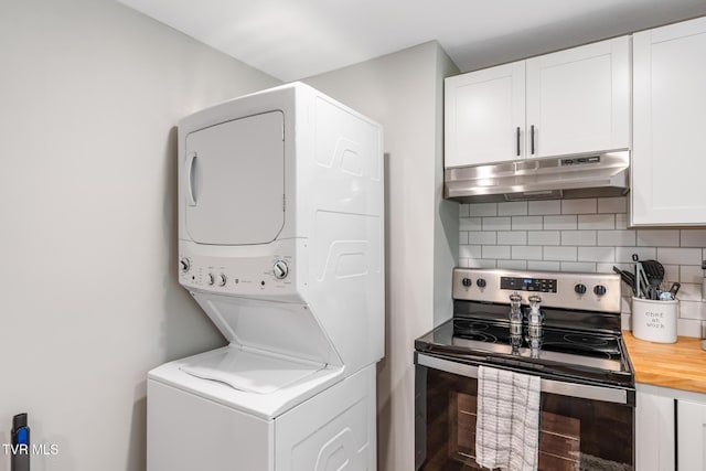 laundry area featuring laundry area and stacked washer / dryer