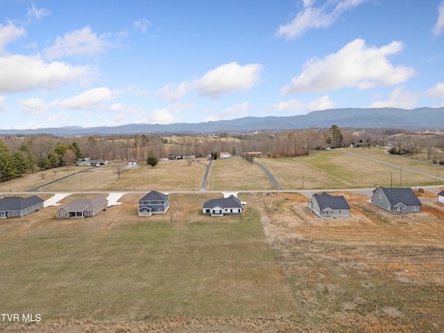 birds eye view of property featuring a rural view and a mountain view