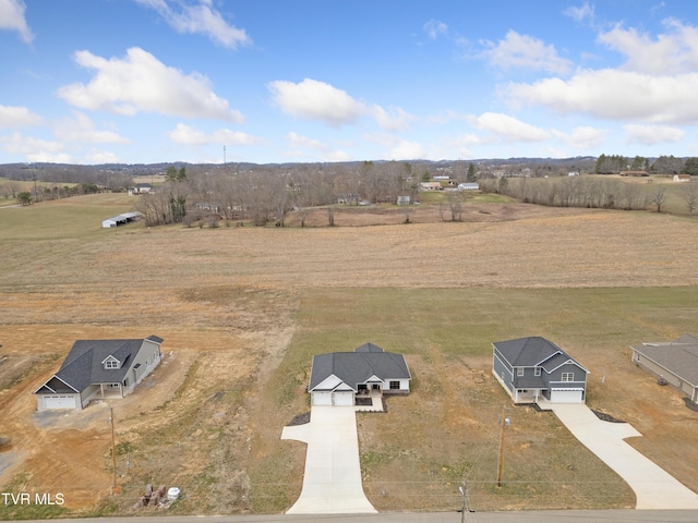 birds eye view of property featuring a rural view