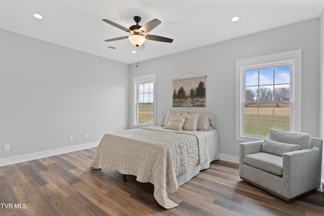 bedroom featuring dark wood-style floors, visible vents, baseboards, recessed lighting, and ceiling fan