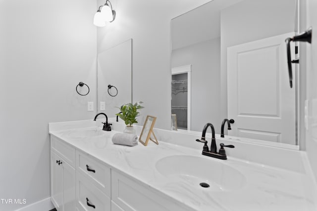 full bath featuring double vanity and a sink