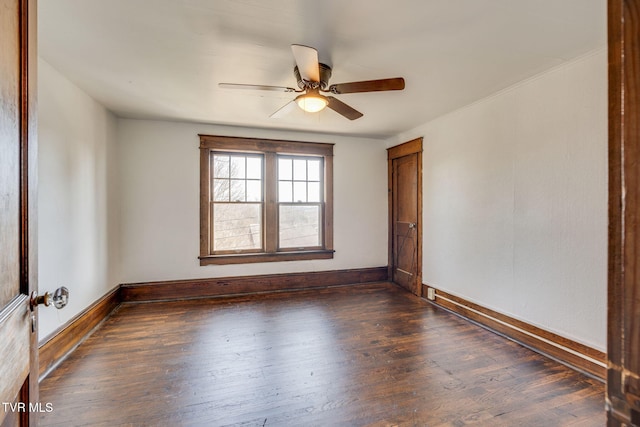 unfurnished room featuring wood finished floors, baseboards, and ceiling fan