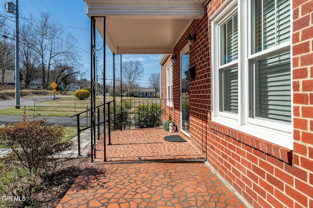 view of patio featuring fence