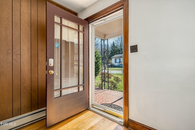 doorway with light wood finished floors