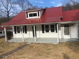 view of front of home with covered porch and metal roof