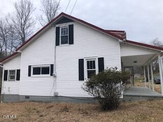 view of side of property featuring crawl space