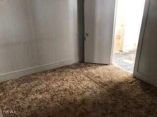 unfurnished room featuring carpet