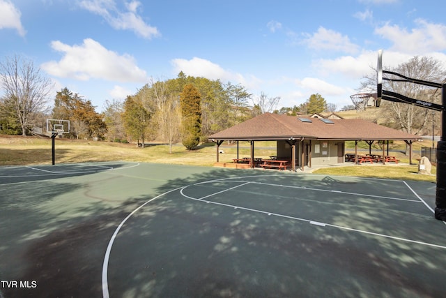 view of sport court featuring community basketball court and a lawn