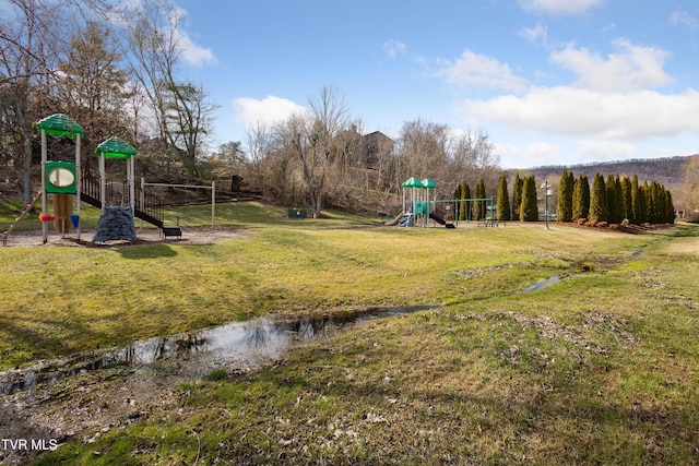 communal playground with a lawn