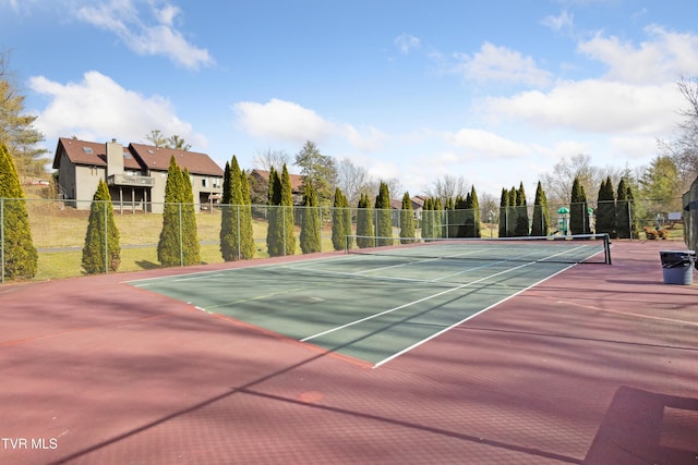 view of sport court with fence