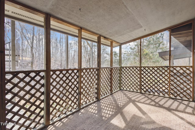 unfurnished sunroom featuring plenty of natural light